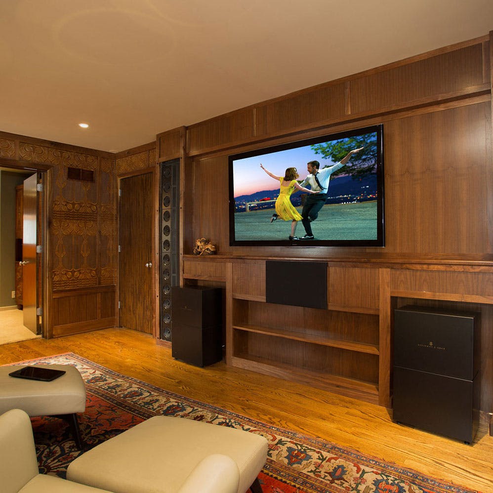 Home theater with mounted television and hi-fi sound system